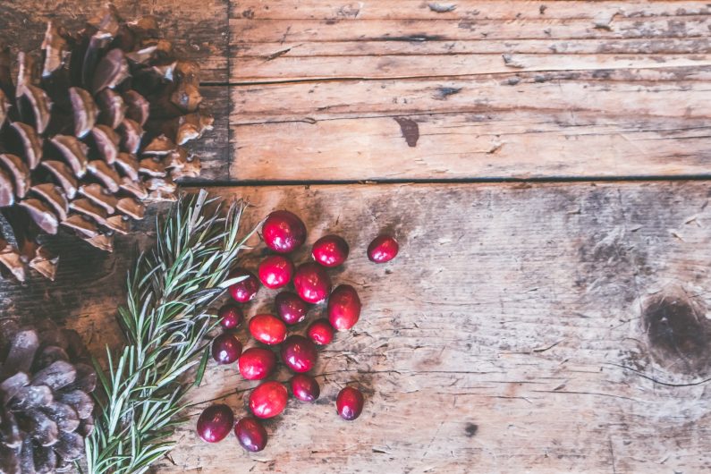 Pine cones and berries make a great addition to wreaths. Image source: Pexels